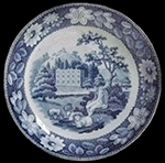 Pearlware teapot printed underglaze in medium blue. Scene shows a shepherd and sheep in a country estate setting. Continuous repeating floral border. Transferware Collector’s Club named this pattern “Elegant Shepherd Boy”. 3.5” base diameter.